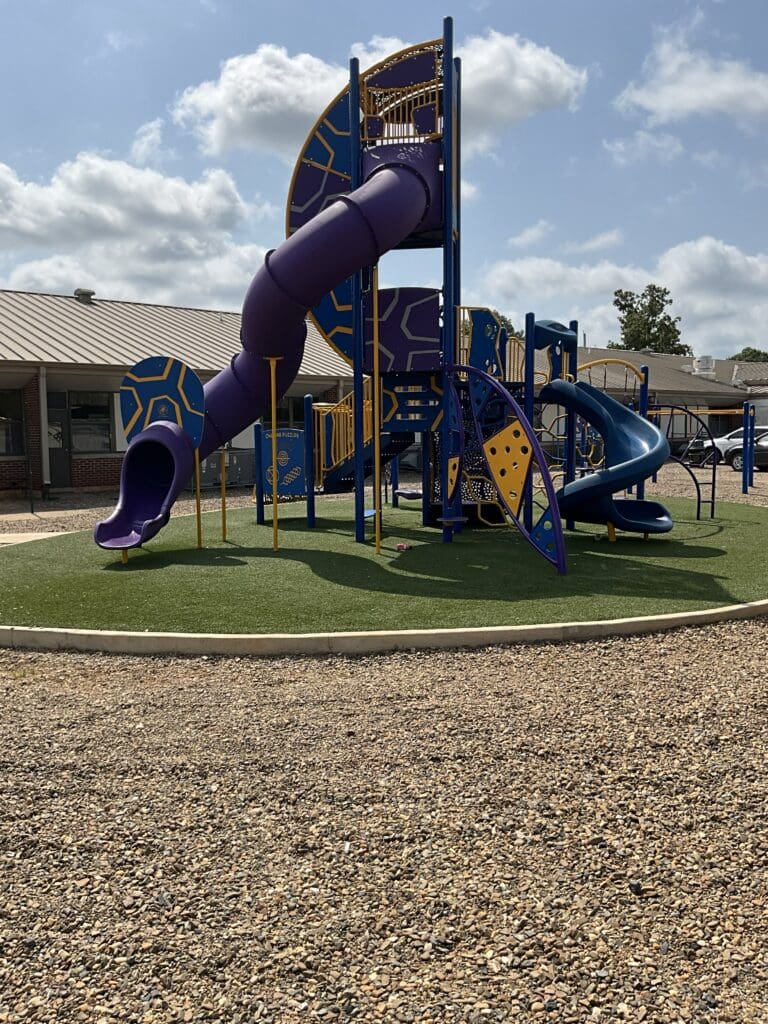 Purple spiral tube slide on playground