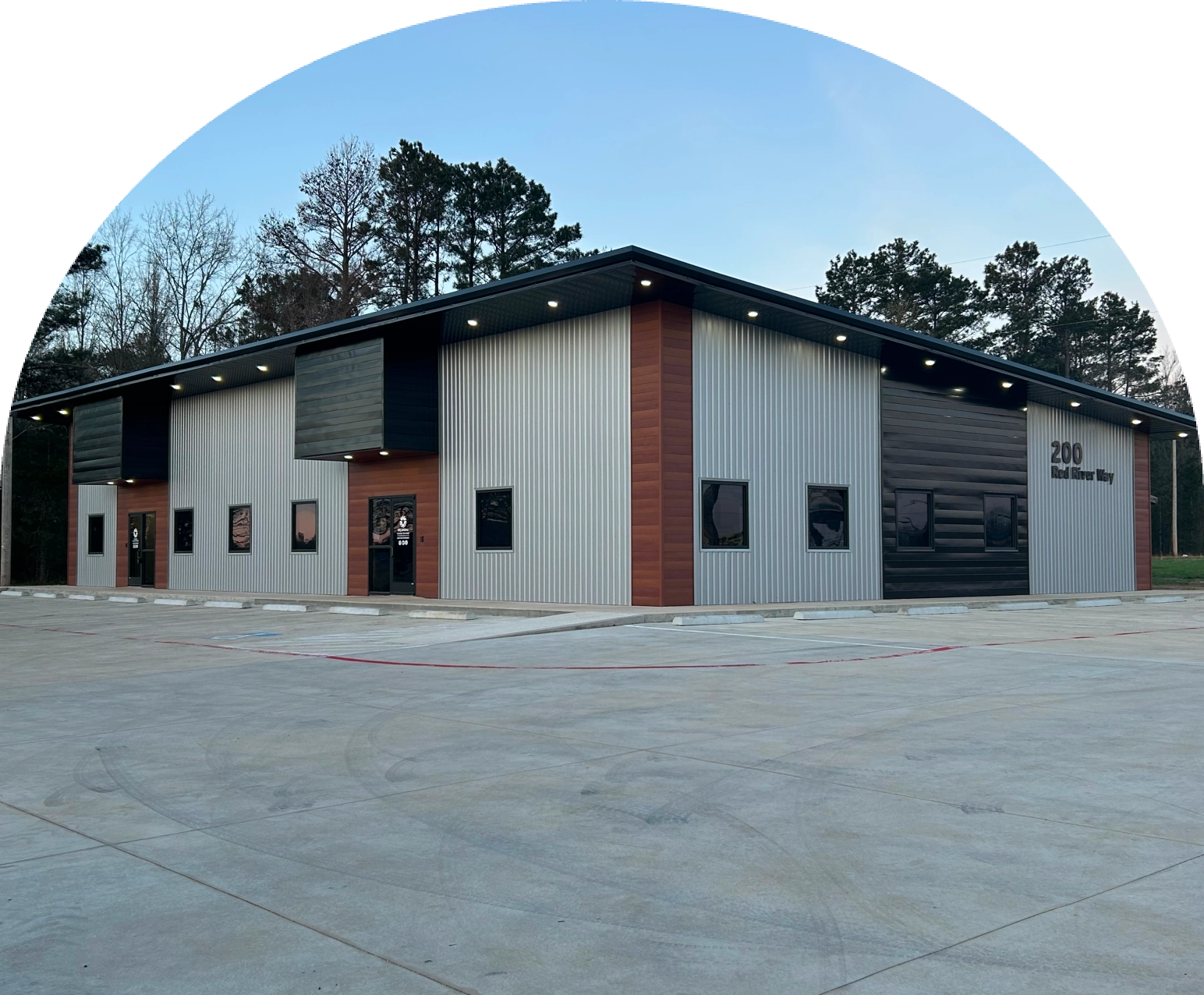Modern metal clad commercial building with parking